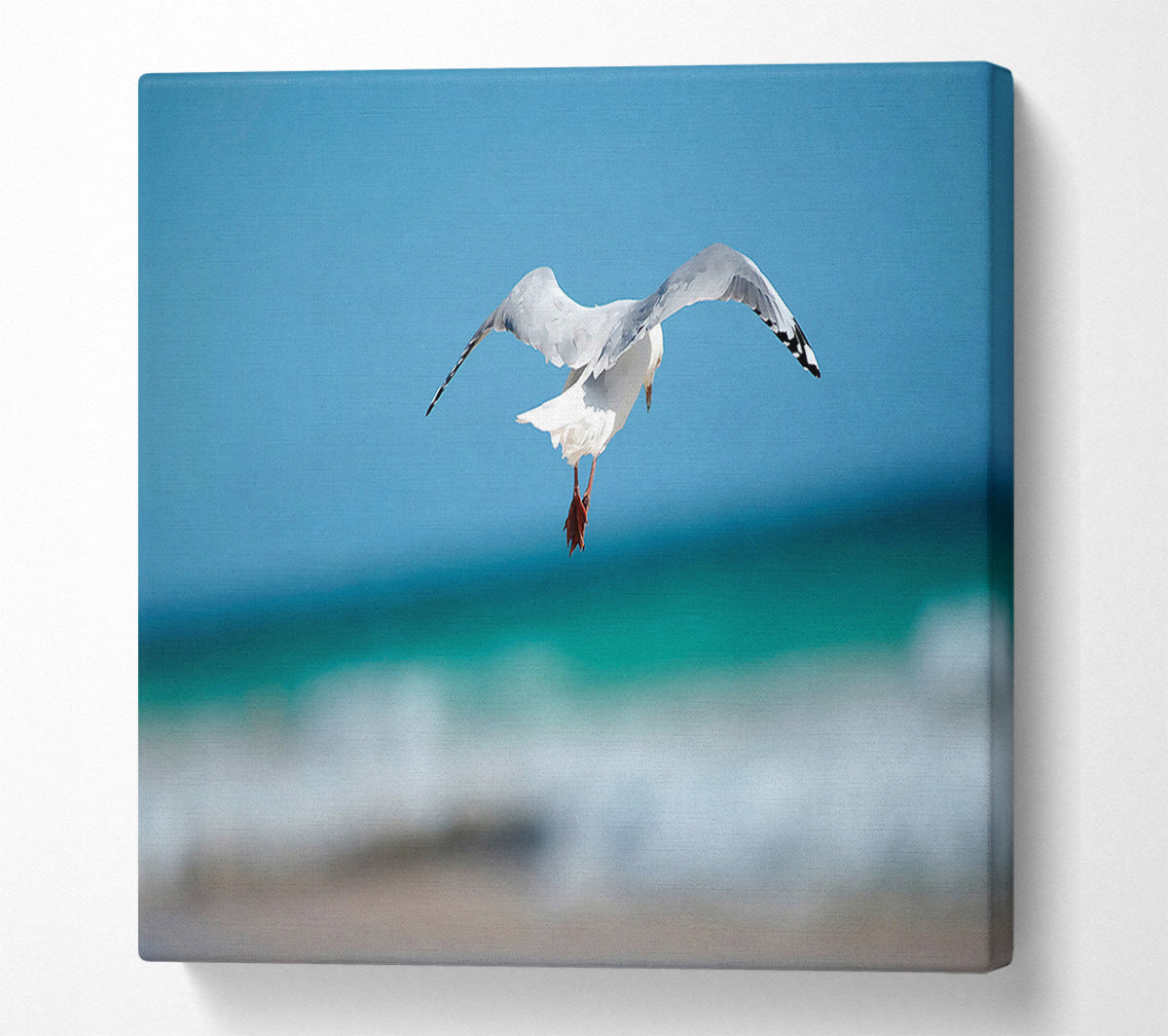 Seagull Over The Ocean Canvas Wall Art