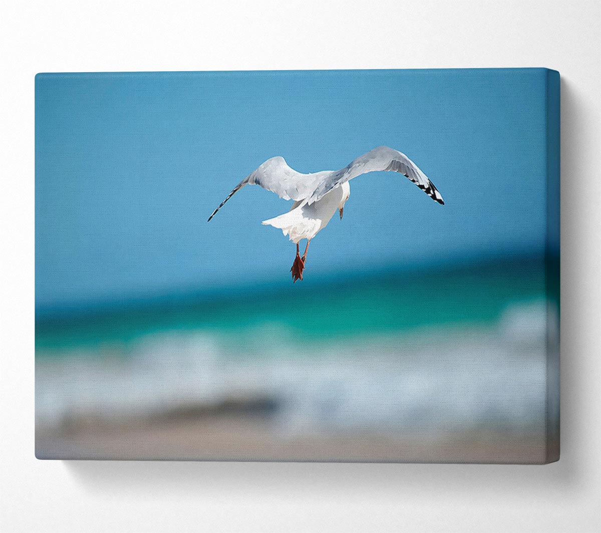 Seagull Over The Ocean Canvas Wall Art