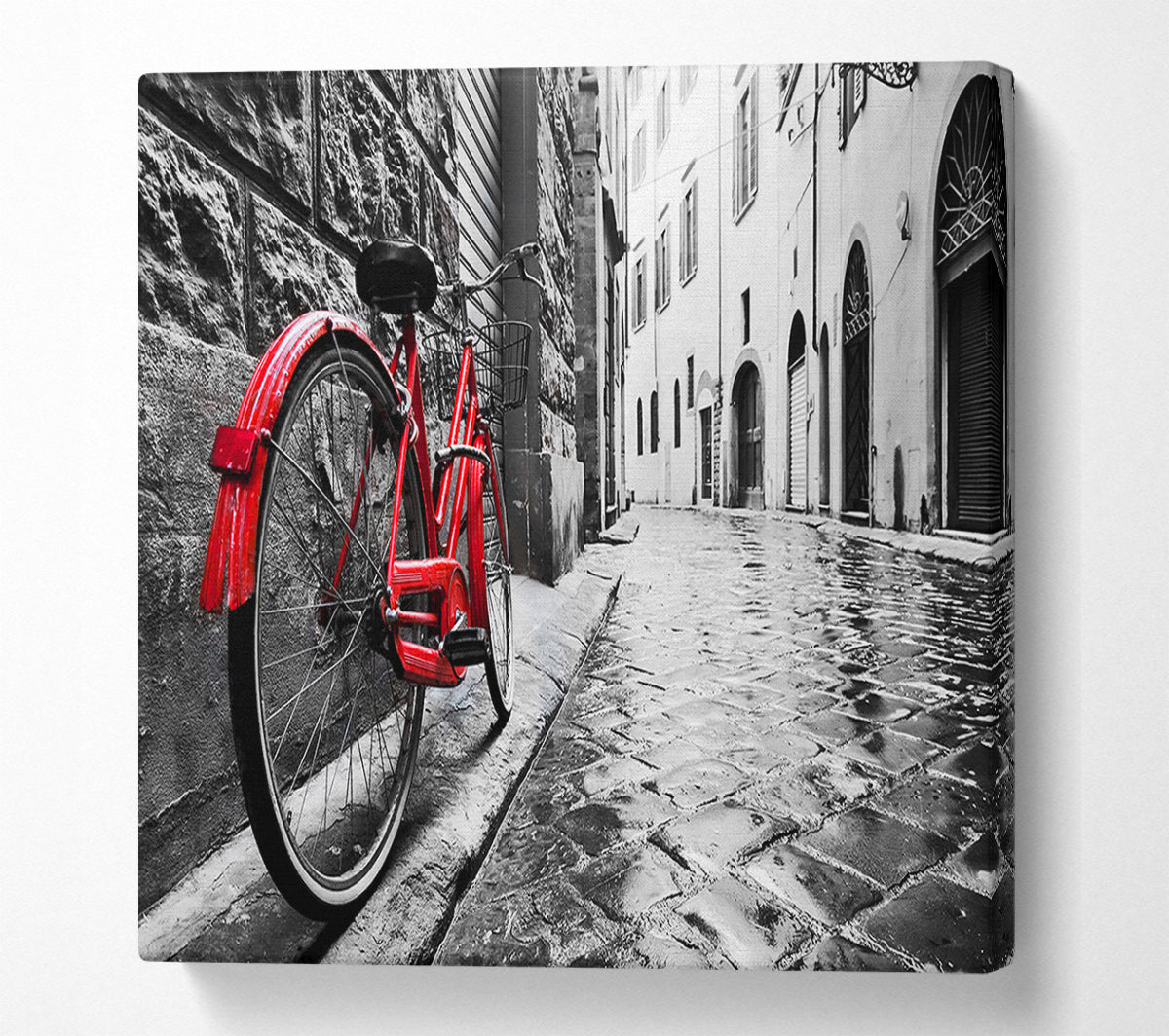 Red Bicycle In The Cobbled Streets Canvas Wall Art