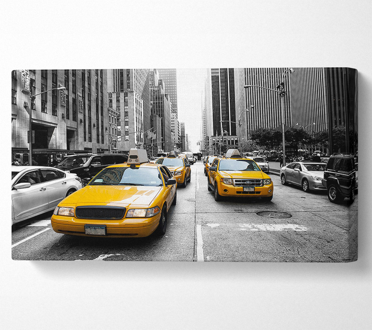 Yellow Cabs On The Inner City Steets Canvas Wall Art