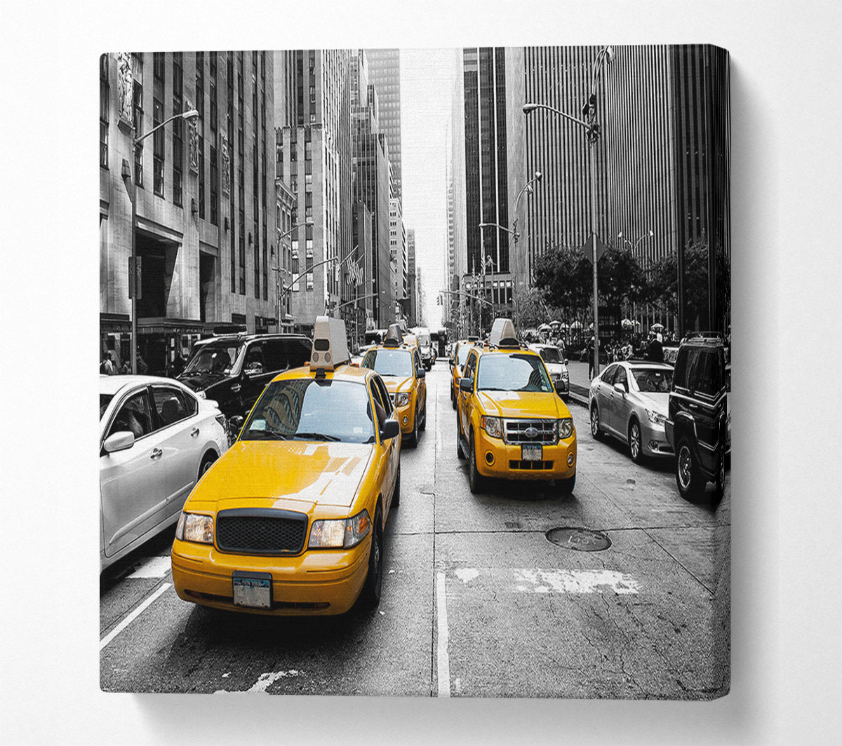 Yellow Cabs On The Inner City Steets Canvas Wall Art