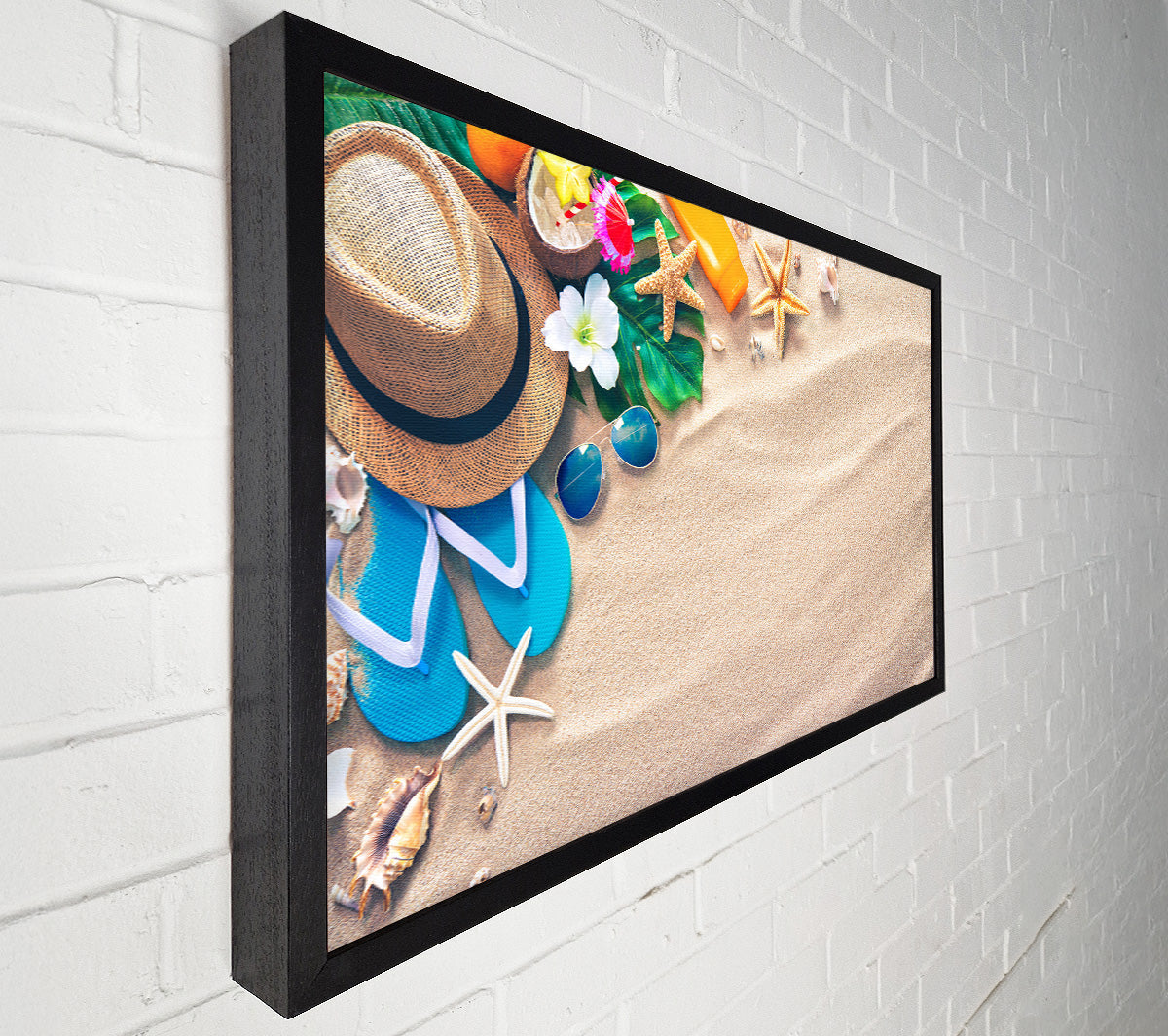 Sunglasses and hat on the beach Canvas Wall Art