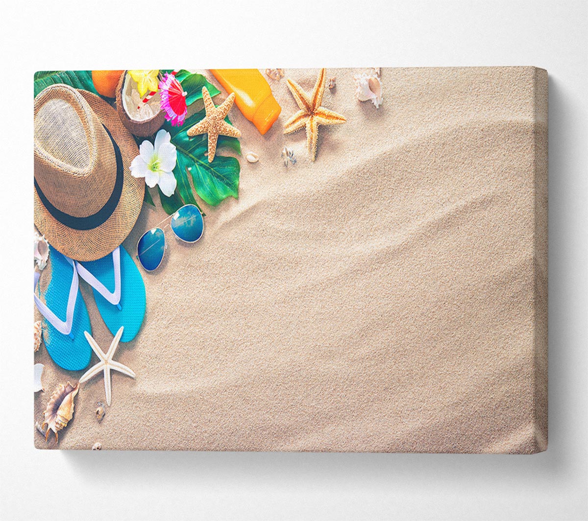 Sunglasses and hat on the beach Canvas Wall Art
