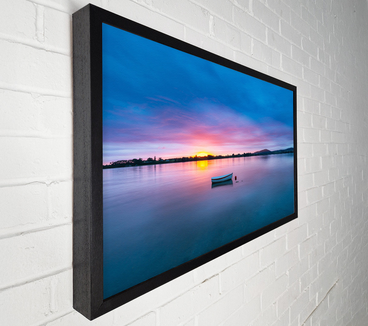 Small row boat on calm lake Canvas Wall Art