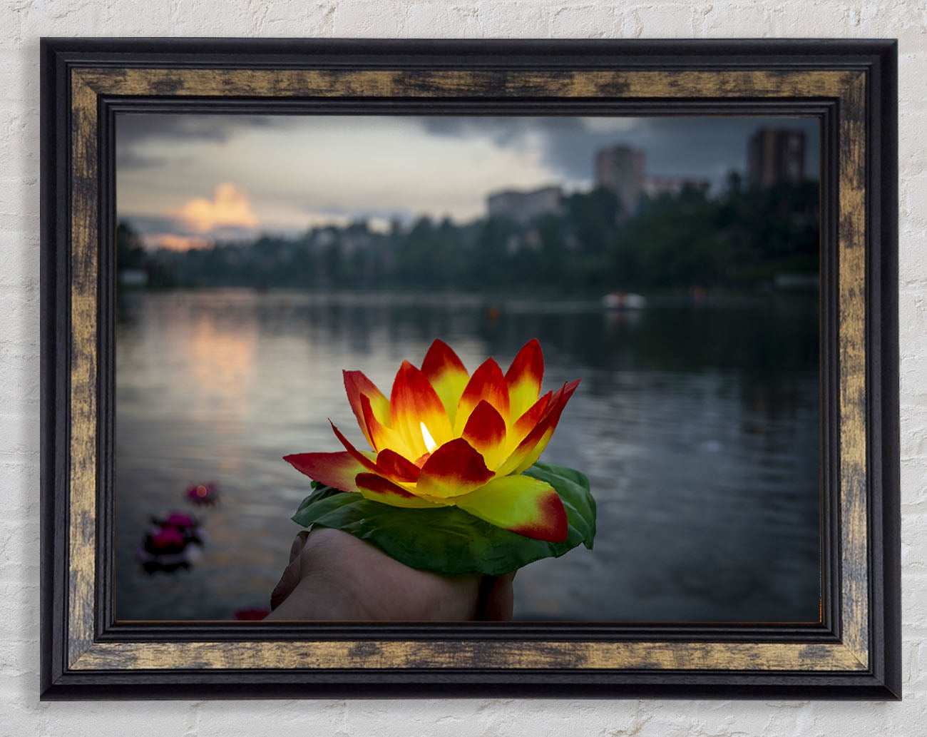 Flower candle in city view Framed Print