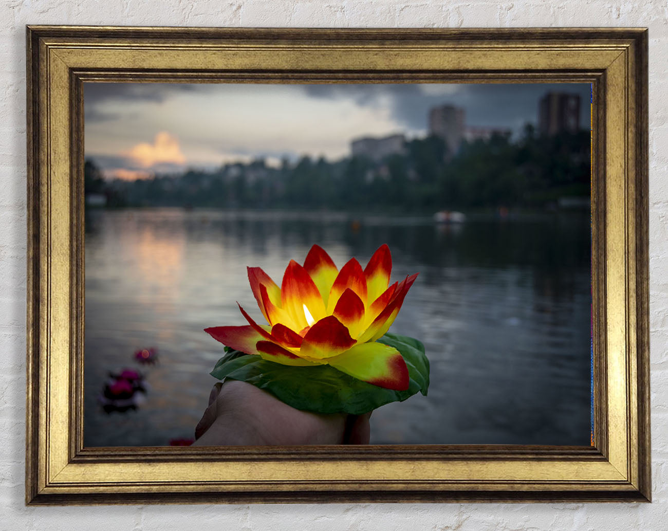 Flower candle in city view Framed Print