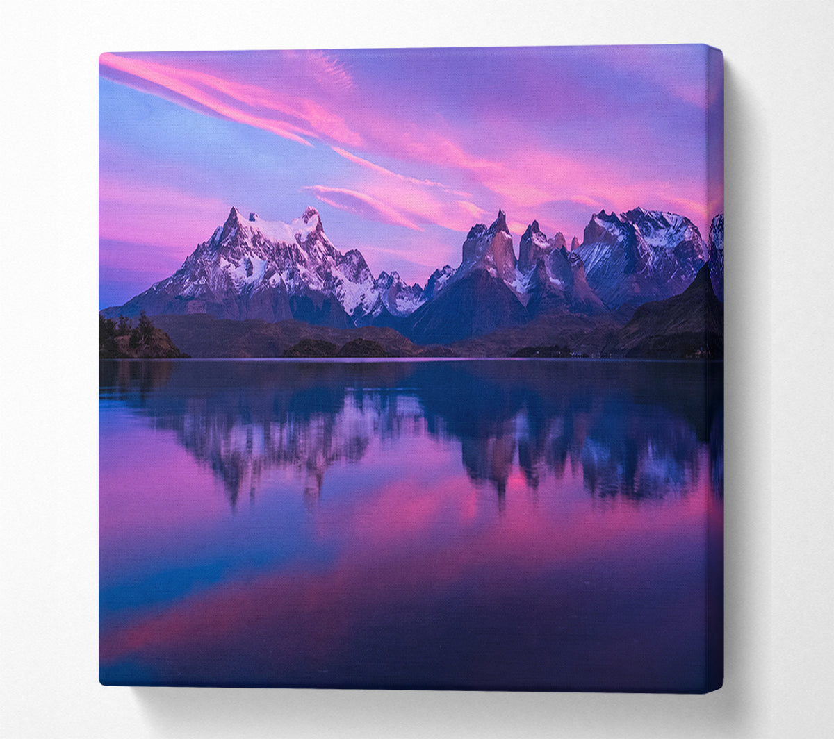 Purple and blue mountains above lake Canvas Wall Art