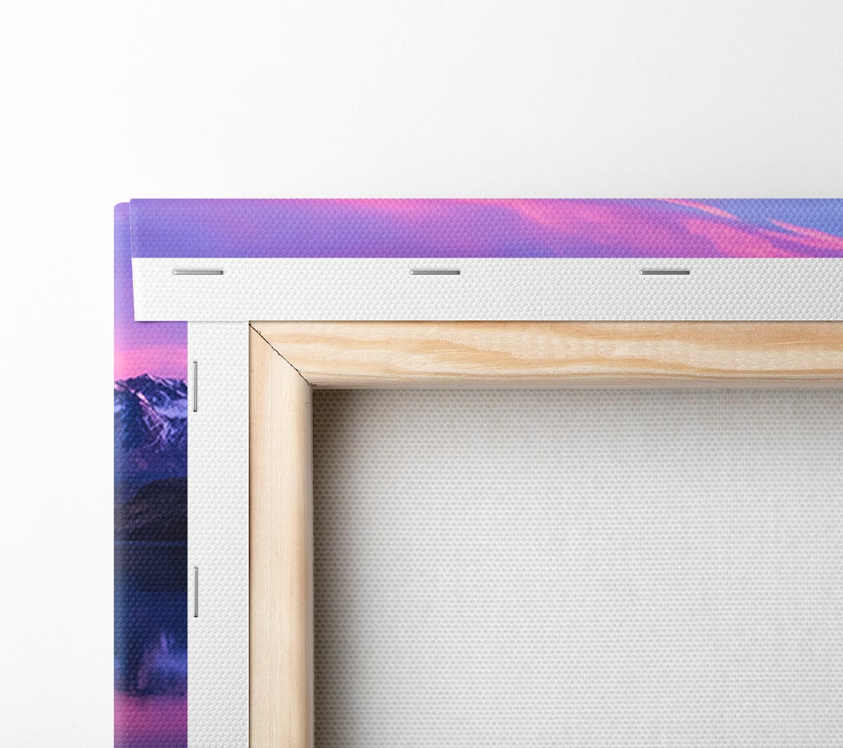 Purple and blue mountains above lake Canvas Wall Art