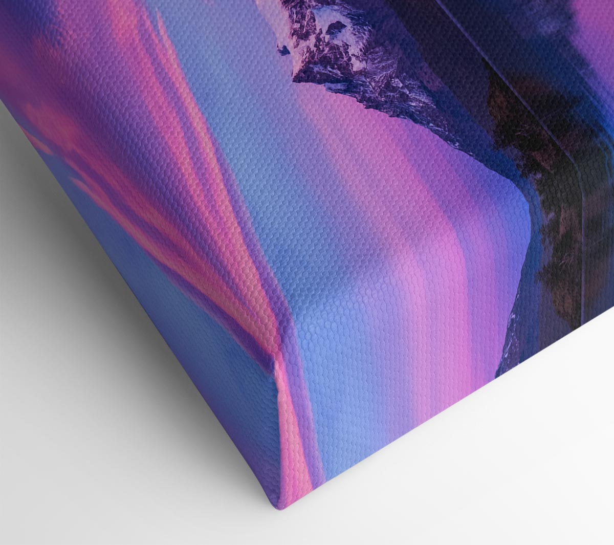 Purple and blue mountains above lake Canvas Wall Art