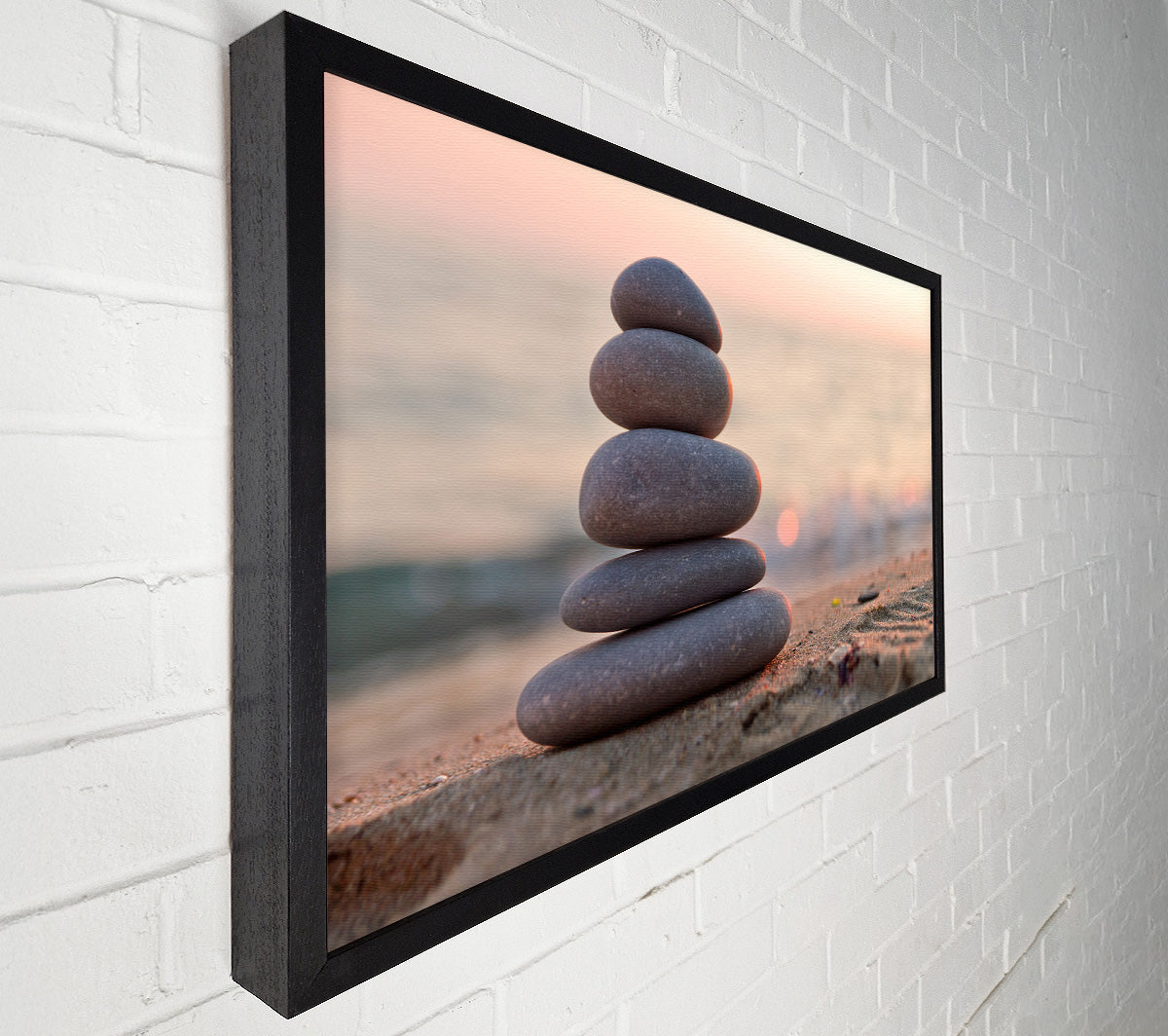 Zen stones stacked up on beach Canvas Wall Art