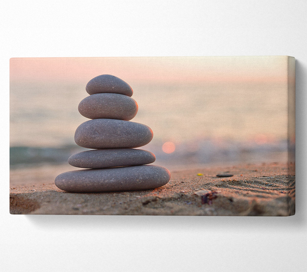 Zen stones stacked up on beach Canvas Wall Art