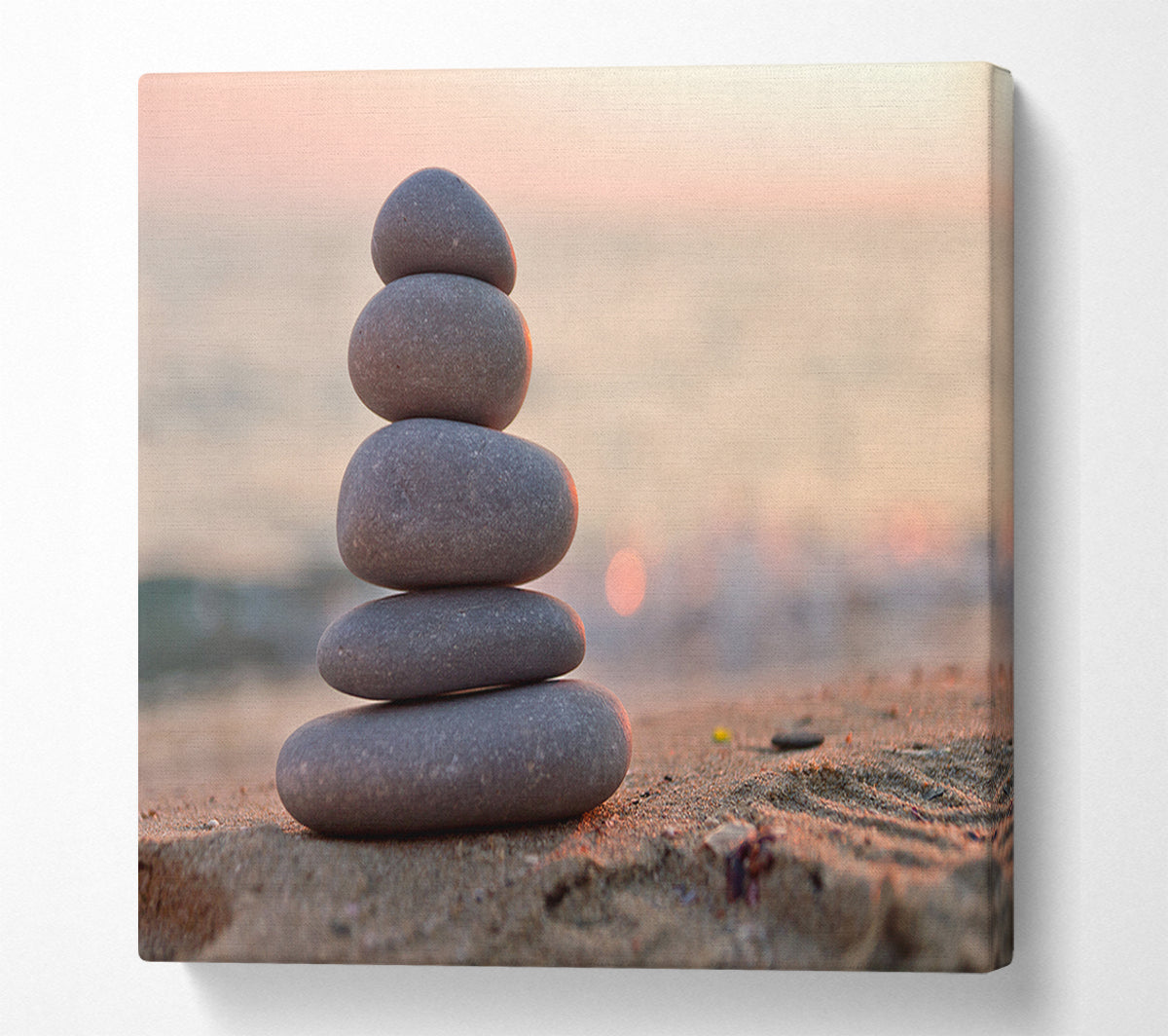 Zen stones stacked up on beach Canvas Wall Art