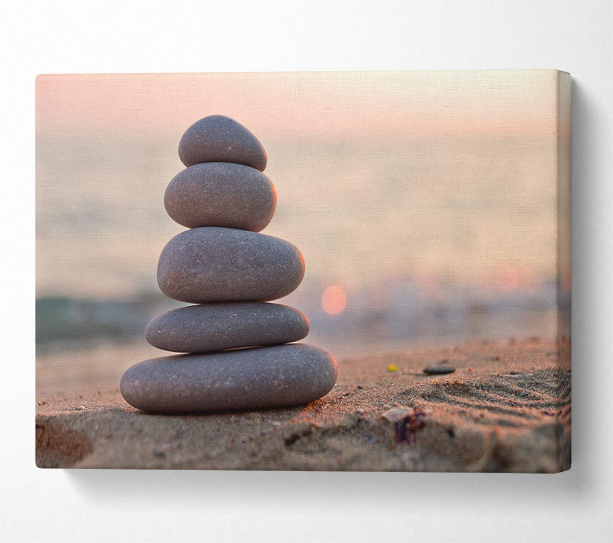 Zen stones stacked up on beach Canvas Wall Art