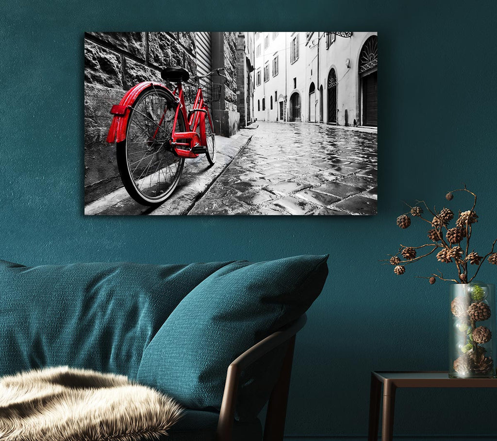 Red Bicycle In The Cobbled Streets Canvas Wall Art