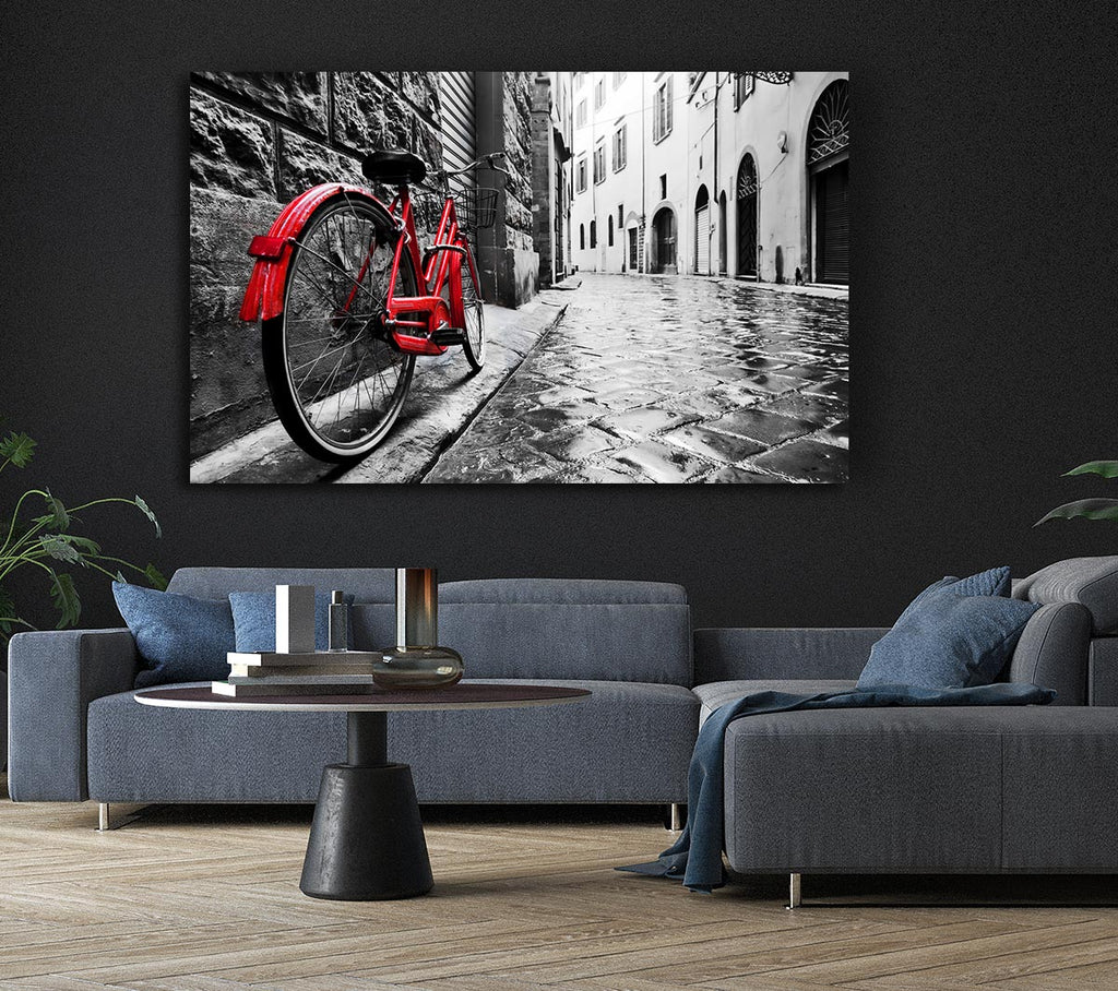 Red Bicycle In The Cobbled Streets Canvas Wall Art