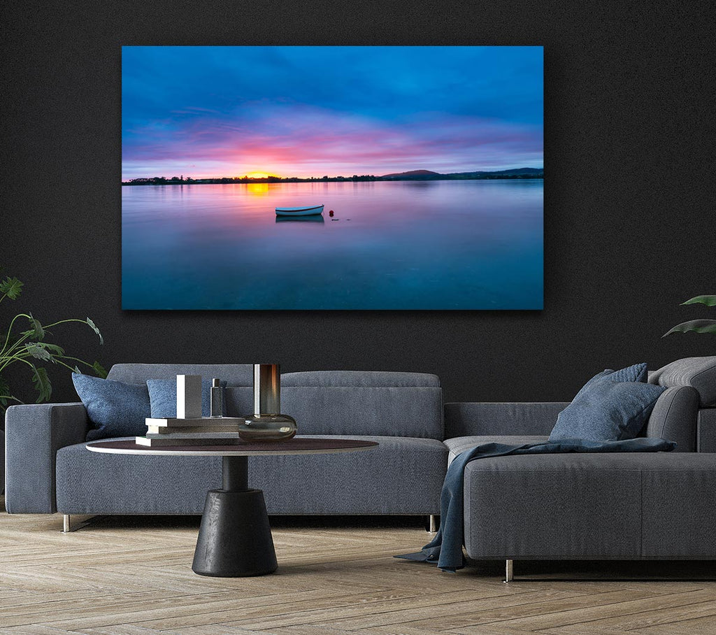 Small row boat on calm lake Canvas Wall Art